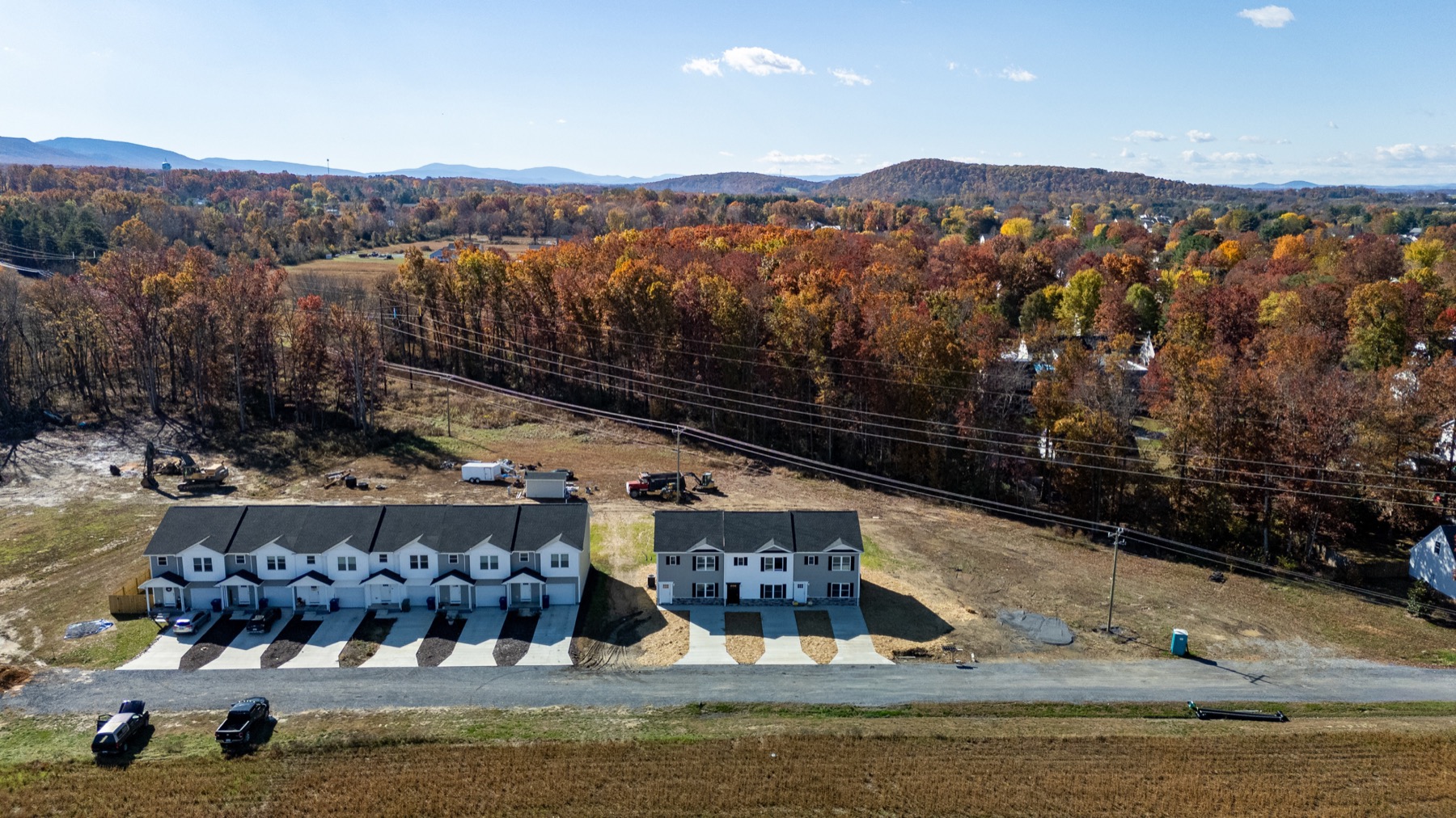 Aerial view of the Forest Station townhomes on 21st Street in Grottoes with fall color and the Blue Ridge behind